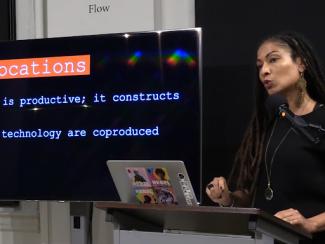 person in front of a computer presenting