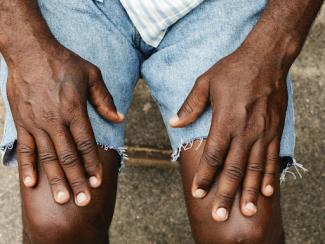 black man with hands on his knees