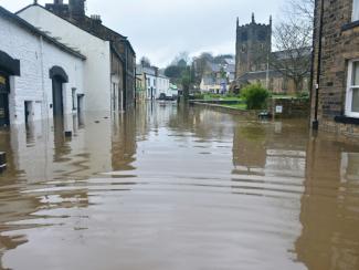 flooded town under blue sky and white clouds