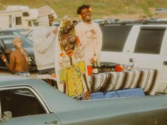 a group of people in clothing on a car