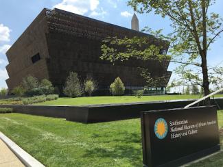 front of the smithsonian national museum of african american 