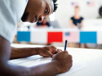 african american man voter in polling place 