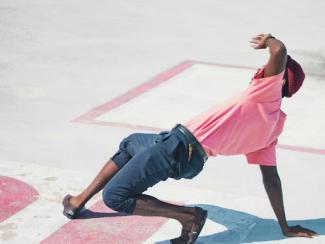 man dancing on concrete 