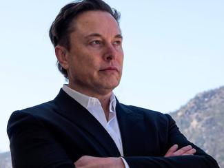 elon crossing his arms