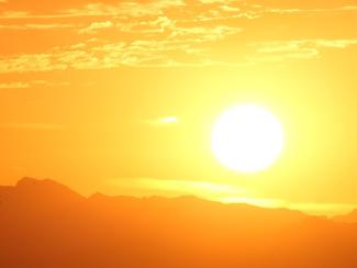 sun rising over mountains