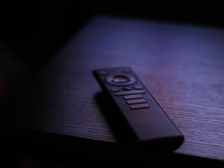 remote on a table in the dark