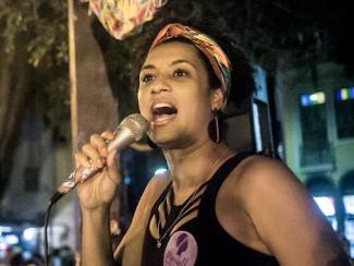woman speaking into a microphone