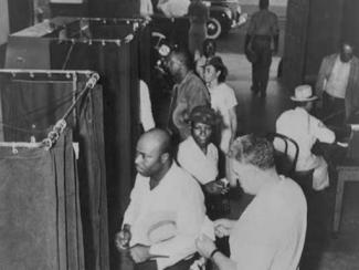 voters at the voting booths in 1945