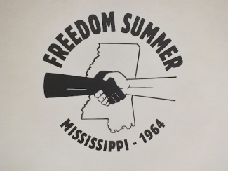two hands clasping over mississippi saying freedom summer mississippi 1964
