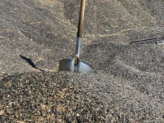 shovel in a pile of sand
