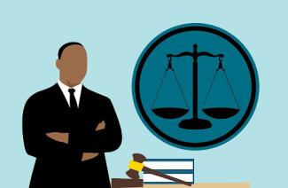 illustration of a black lawyer in front of a justice scale