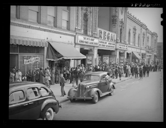 a picture of a main street in west texas full of cars