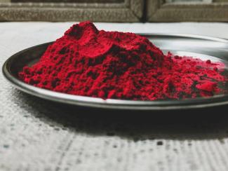 red powder on black plate