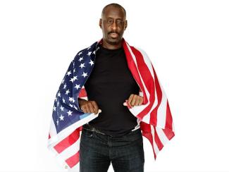 black man holding us flag