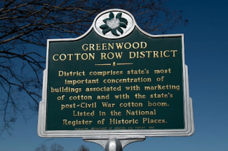 sign that says greenwood cotton row district