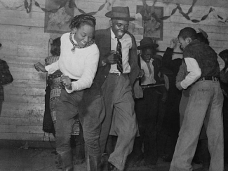 group of black people dancing in a dance hall 