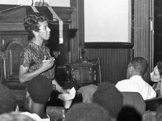 lorraine hansberry speaking to a crowd of young children