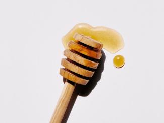 brown woodenstick with honey