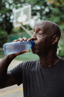 black man drinking water 