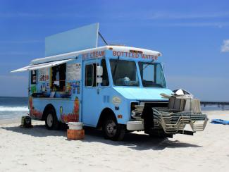 ice cream truck set up on a beach