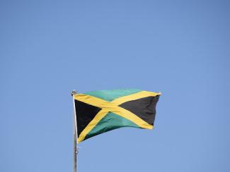 jamaican flag flying in the wind