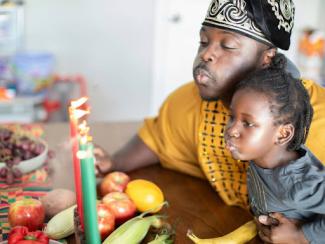 a man and a little girl sitting at a table