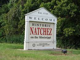 sign that says natchez