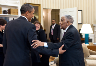photo of President Obama and Dr. Joseph Lowery embracing one another