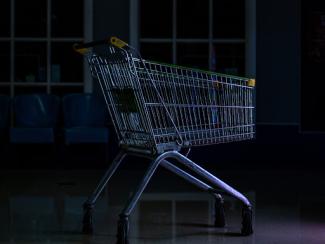 empty shopping cart sitting in the dark