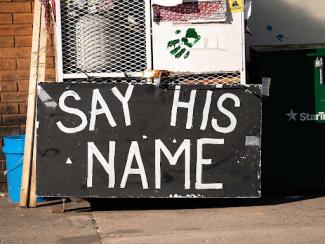 sign that says say his name