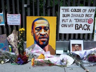 shrine that has a george floyd poster