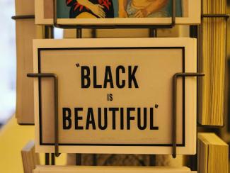 sign that says black is beautiful