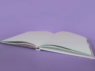 open book on a lavender background 