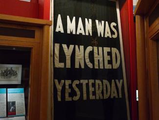 a sign that says a man was lynched yesterday