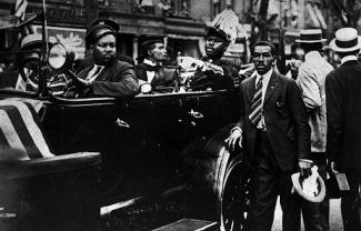 marcus garvey in a car in a procession