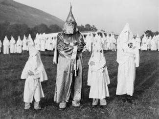 ku klux klan members dressed in white garb