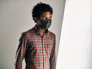black person with a mask on