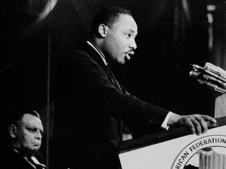 mlk jr speaking in front of a podium