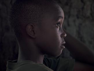 little black boy with a sullen look 