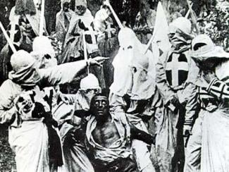 birth of a nation with klansmen and a black man in a still 