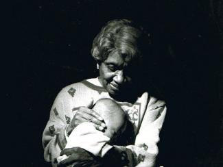 clara "mother" hale holding a child to her chest