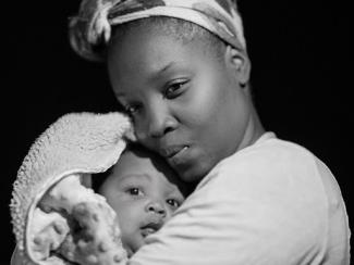 black mom holding her newborn