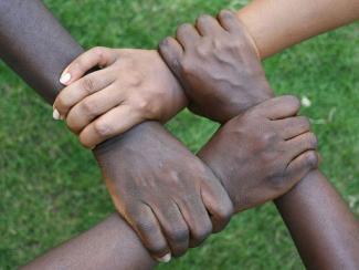 a group of hands holding each other