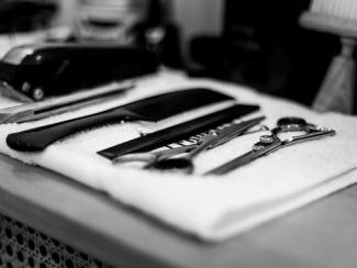 barber tools laying on a clean white towel