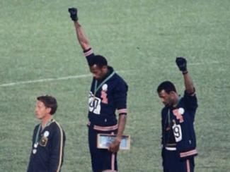 raising fists at olympics
