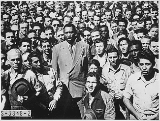 paul robeson standing up in a crowd