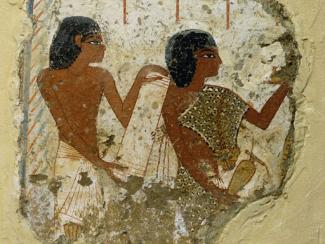 tomb painting depicting two priests holding a papyrus roll 