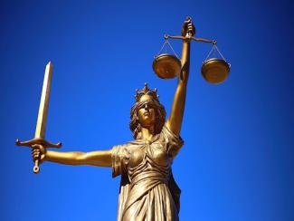 lady justice holding a source and balance scale