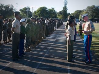 a marine corps recruiter with recruit 