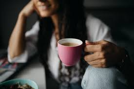 woman holding a cup of tea